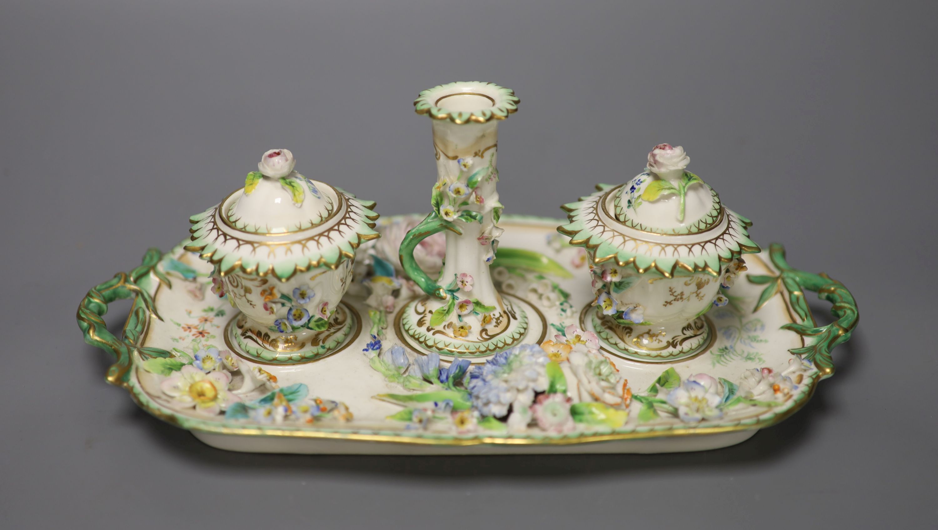 An English porcelain inkstand, of Coalbrookdale type painted and encrusted with flowers c.1830, length 27cm